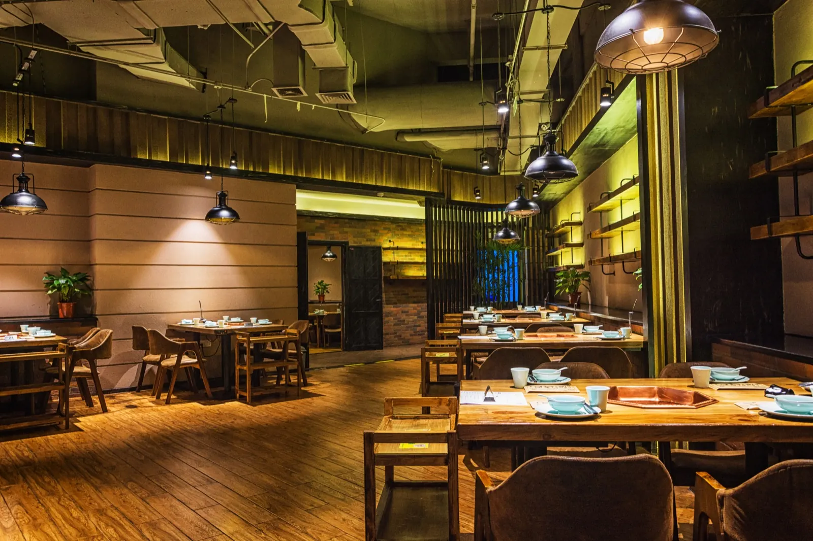 Modern restaurant dining room with commercial kitchen aesthetic
