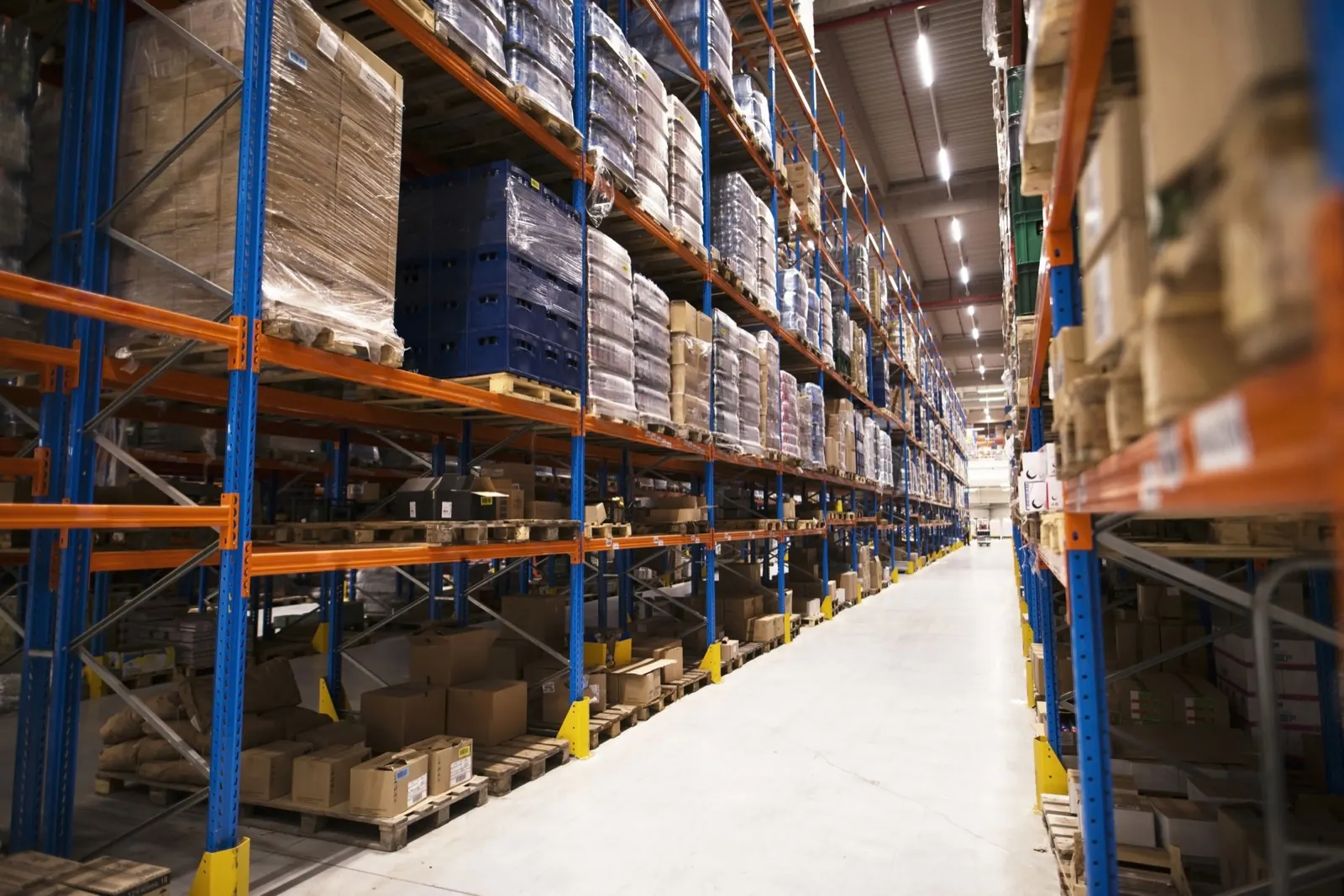 Distribution warehouse aisle with pallet racks and stored inventory
